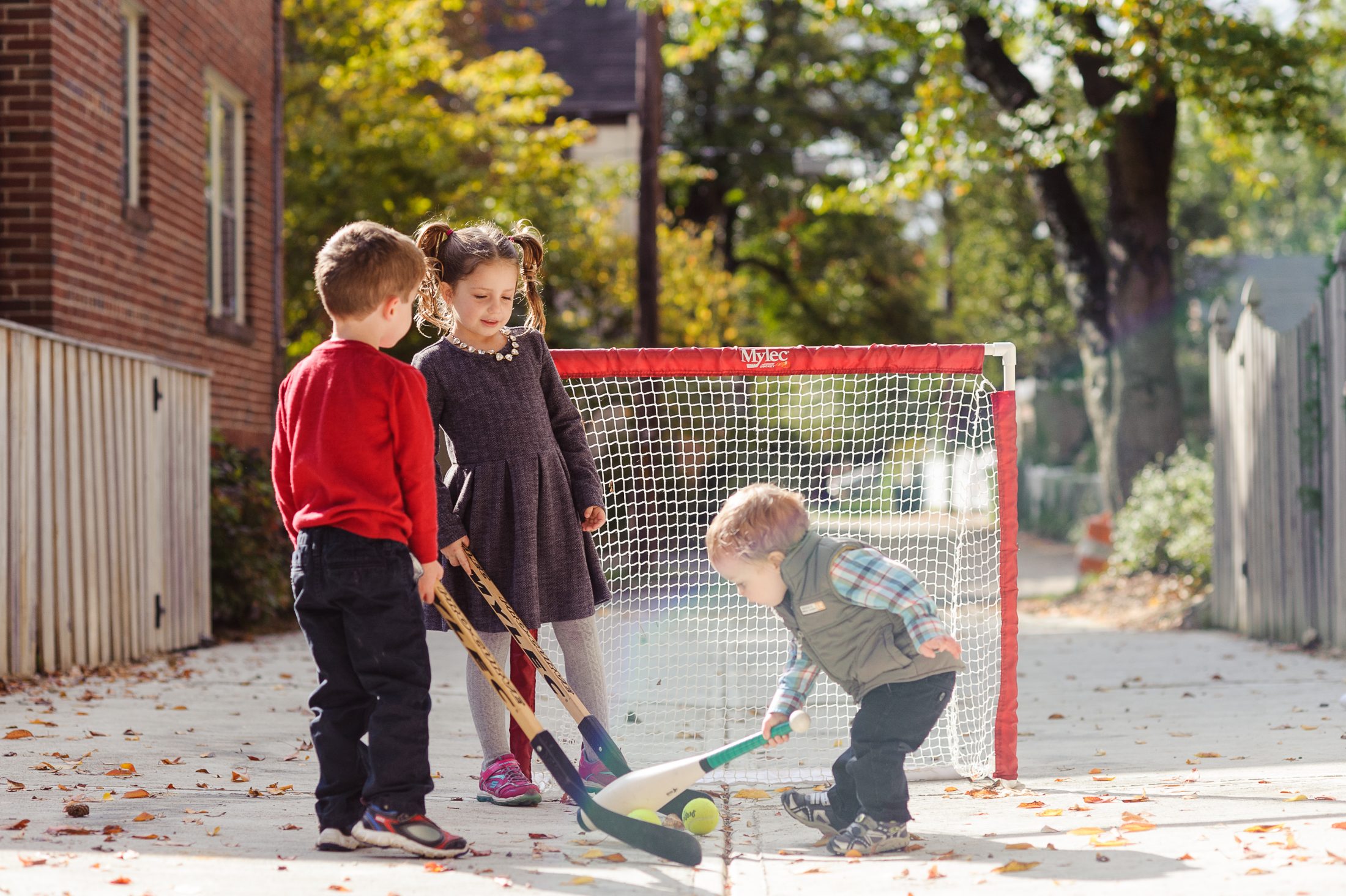Brimley children playing hockey in DC alley