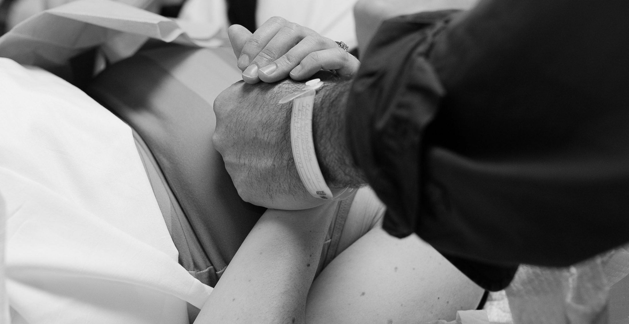 Brimleys holding hands in hospital