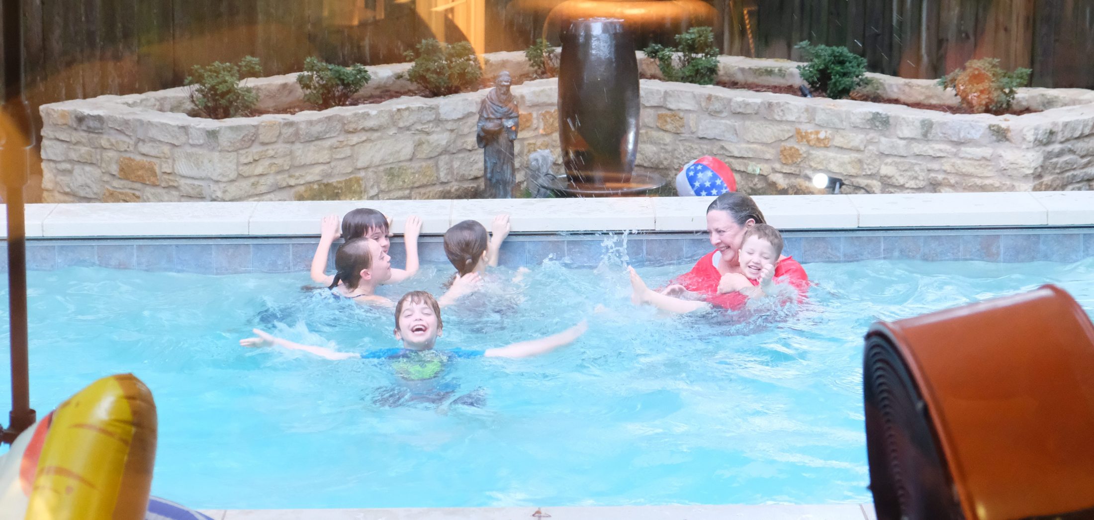 Nana and grandkids in the pool in Texas during family reunion