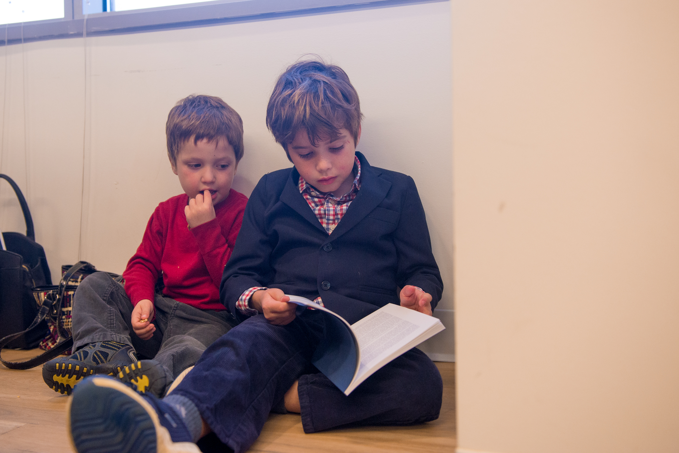 Marjorie Brimley's sons, Austin and Tommy, read a book in DC room