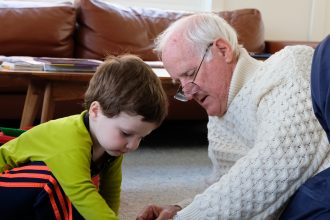 DC widow blog writer Marjorie Brimley's father, Tom, plays legos with her son Tommy