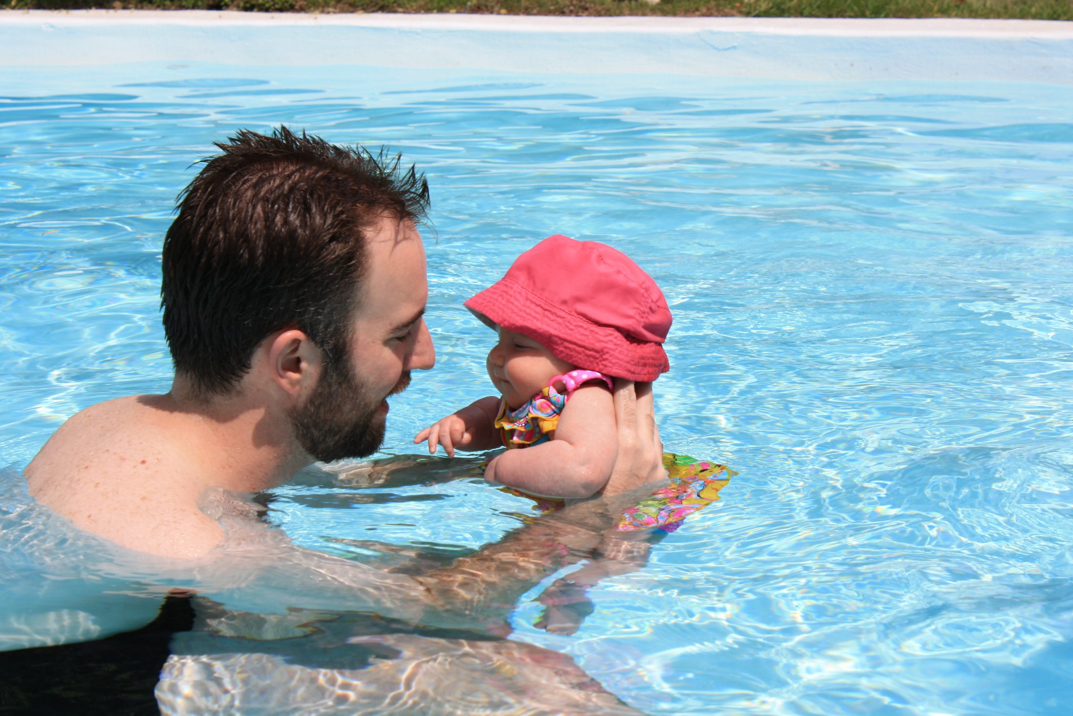 DC widow blog writer Marjorie Brimley's family Shawn and daughter Claire swim in pool when Claire is a baby