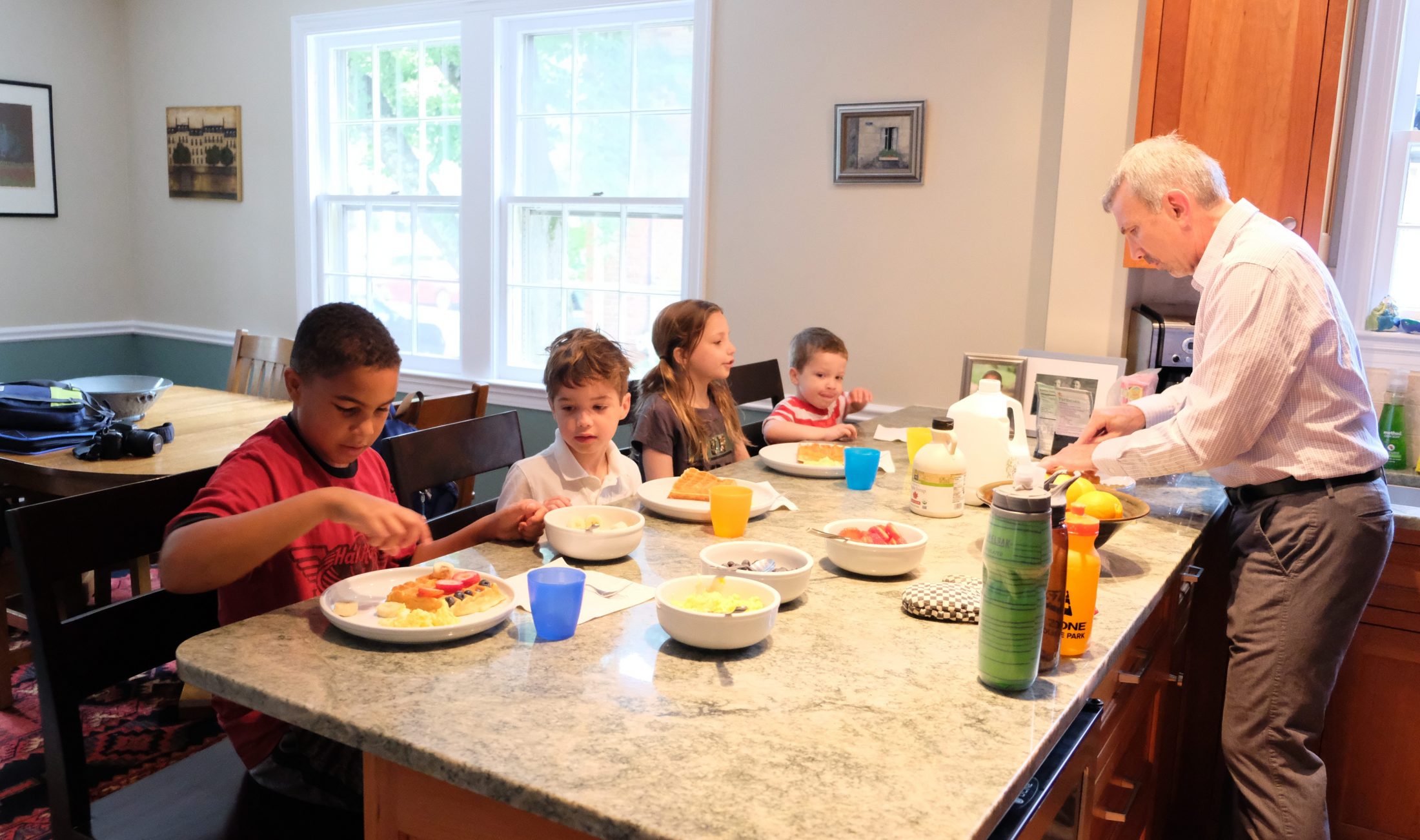 DC widow blog writer Marjorie Brimley's children eat with neighbor family at counter
