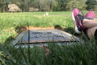 DC widow blog writer Marjorie Brimley's feet at her husband's grave