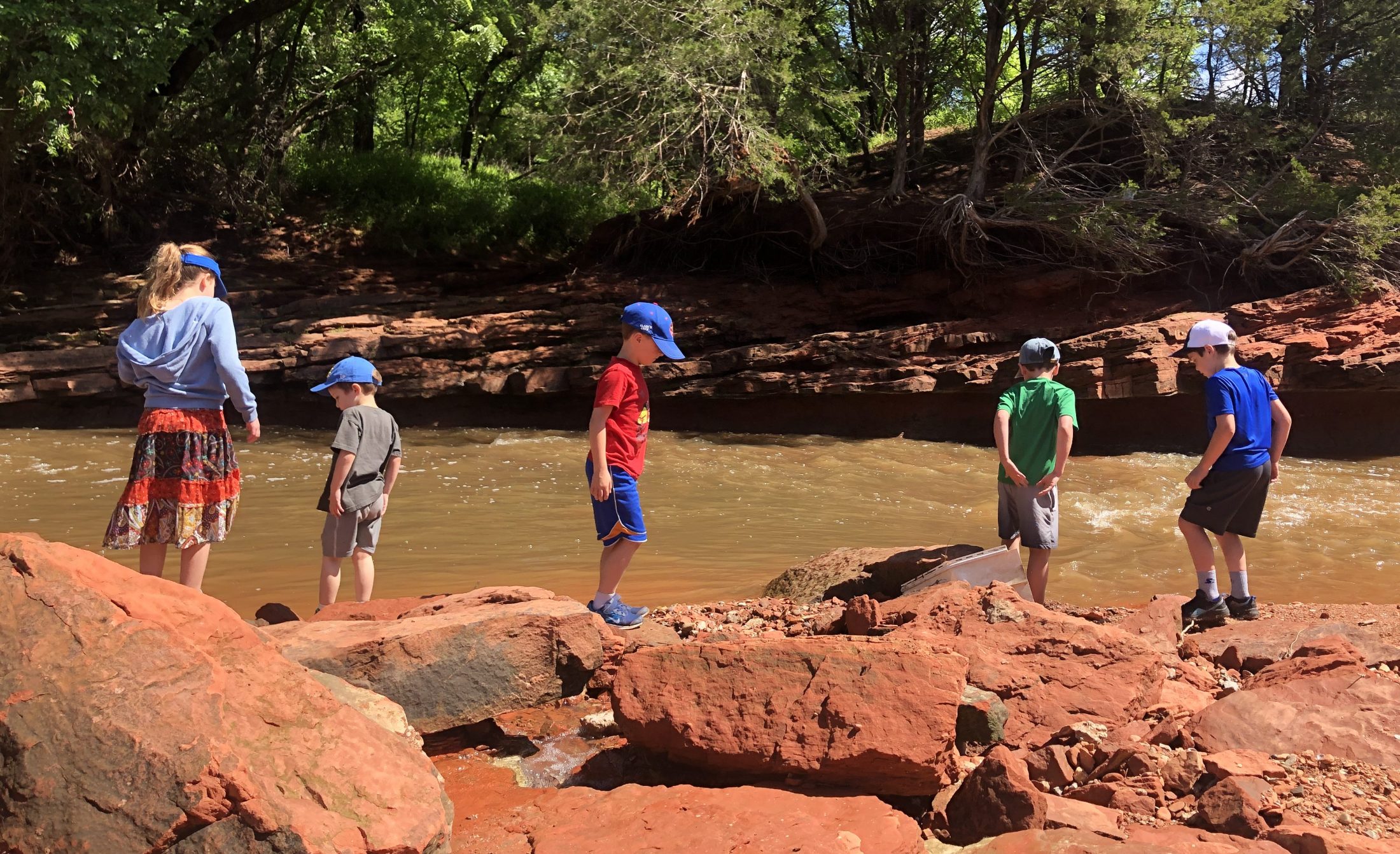 DC widow blog writer Marjorie Brimley's children and their cousins play along a river