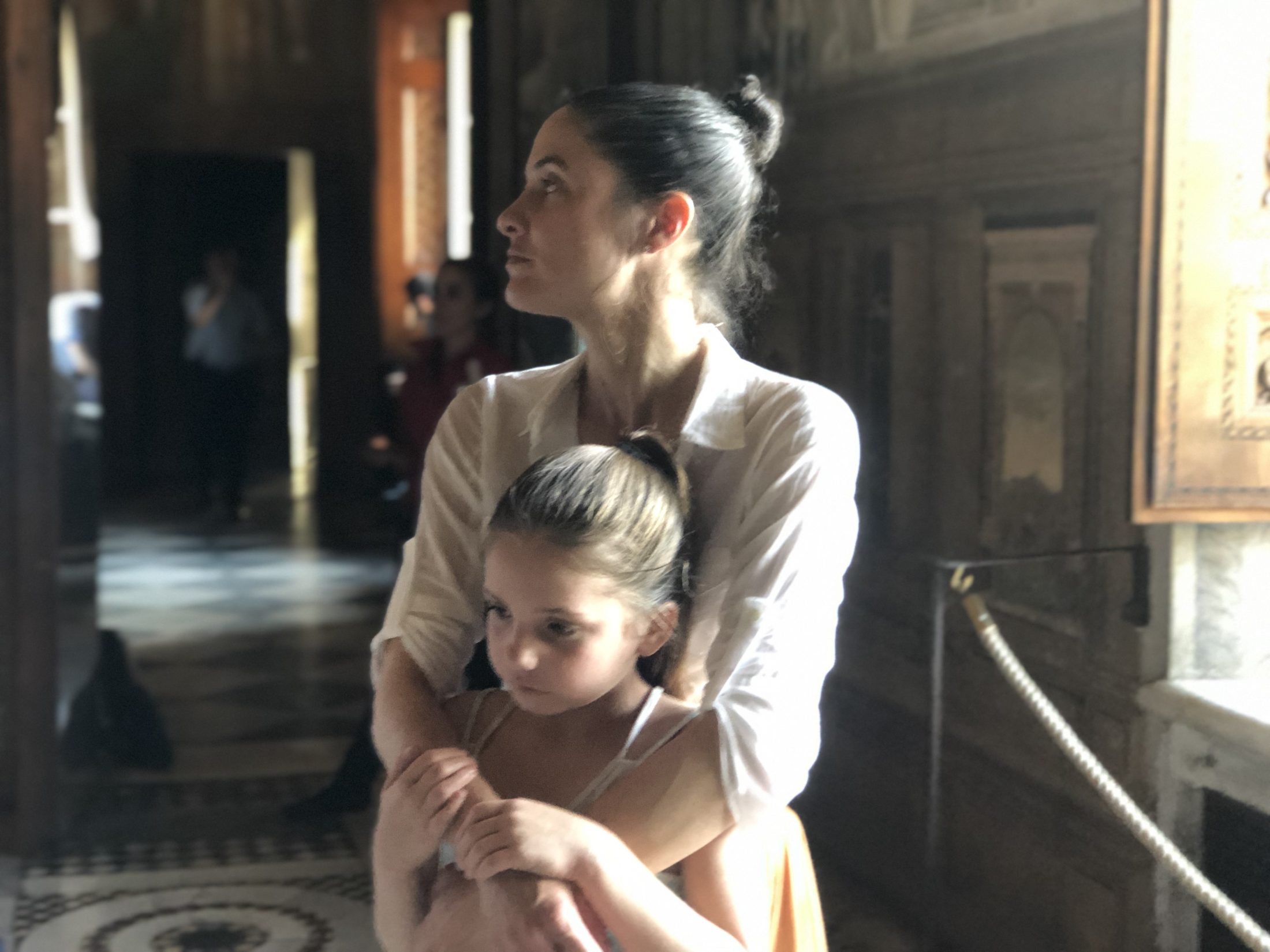 DC widow blog writer Marjorie Brimley hugs daughter Claire in church