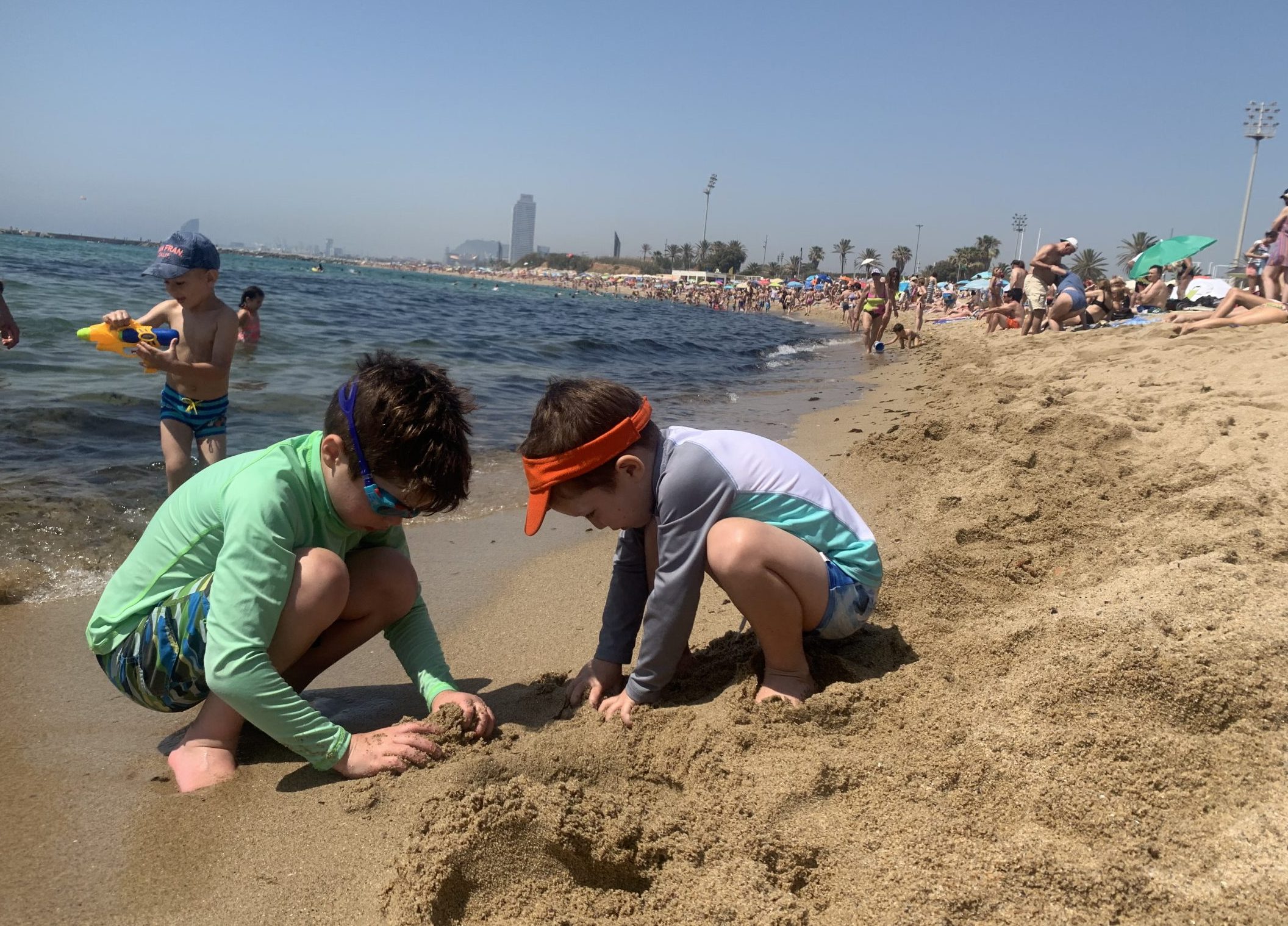 Children of DC widow blog writer Marjorie Brimley build a sandcastle on the beach