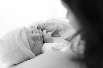 DC widow blog writer Marjorie Brimley holds her baby boy