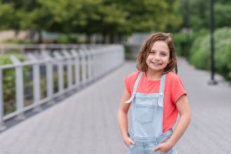 Daughter of DC widow blog writer Marjorie Brimley poses by river