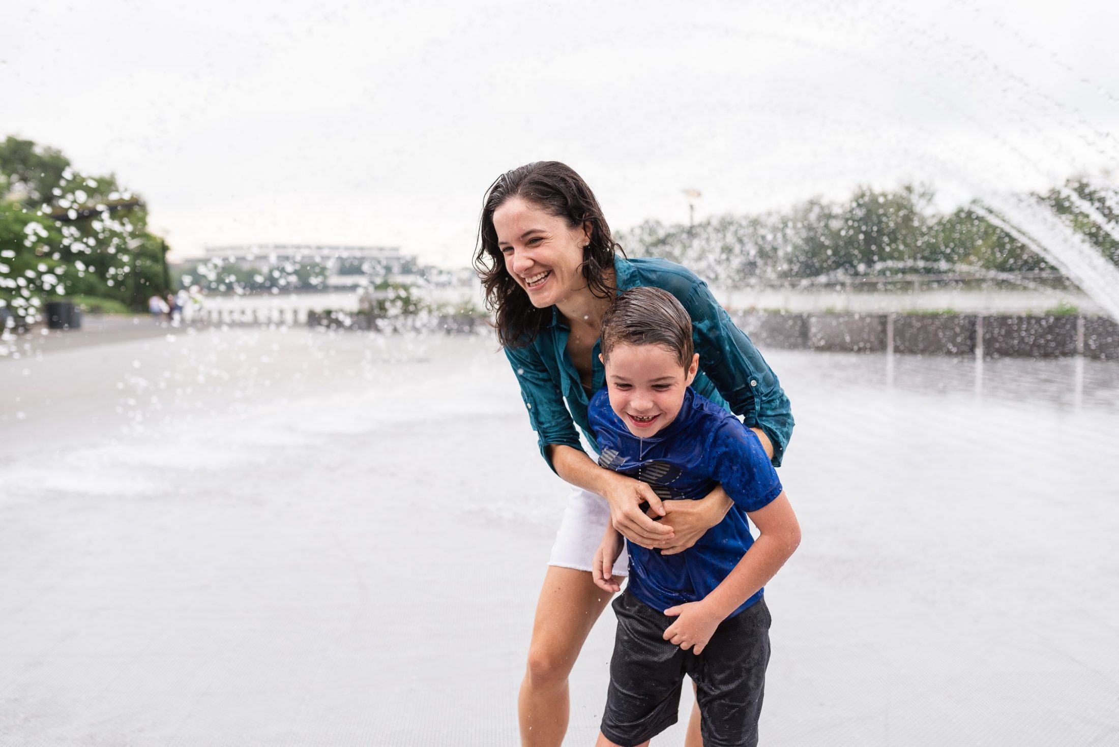 DC widow blog writer Marjorie Brimley hugs son Austin in fountain