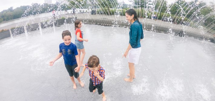 DC widow blog writer Marjorie Brimley plays in fountain with children