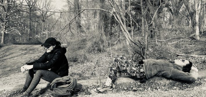 DC widow blog writer Marjorie Brimley in sits in woods with friend