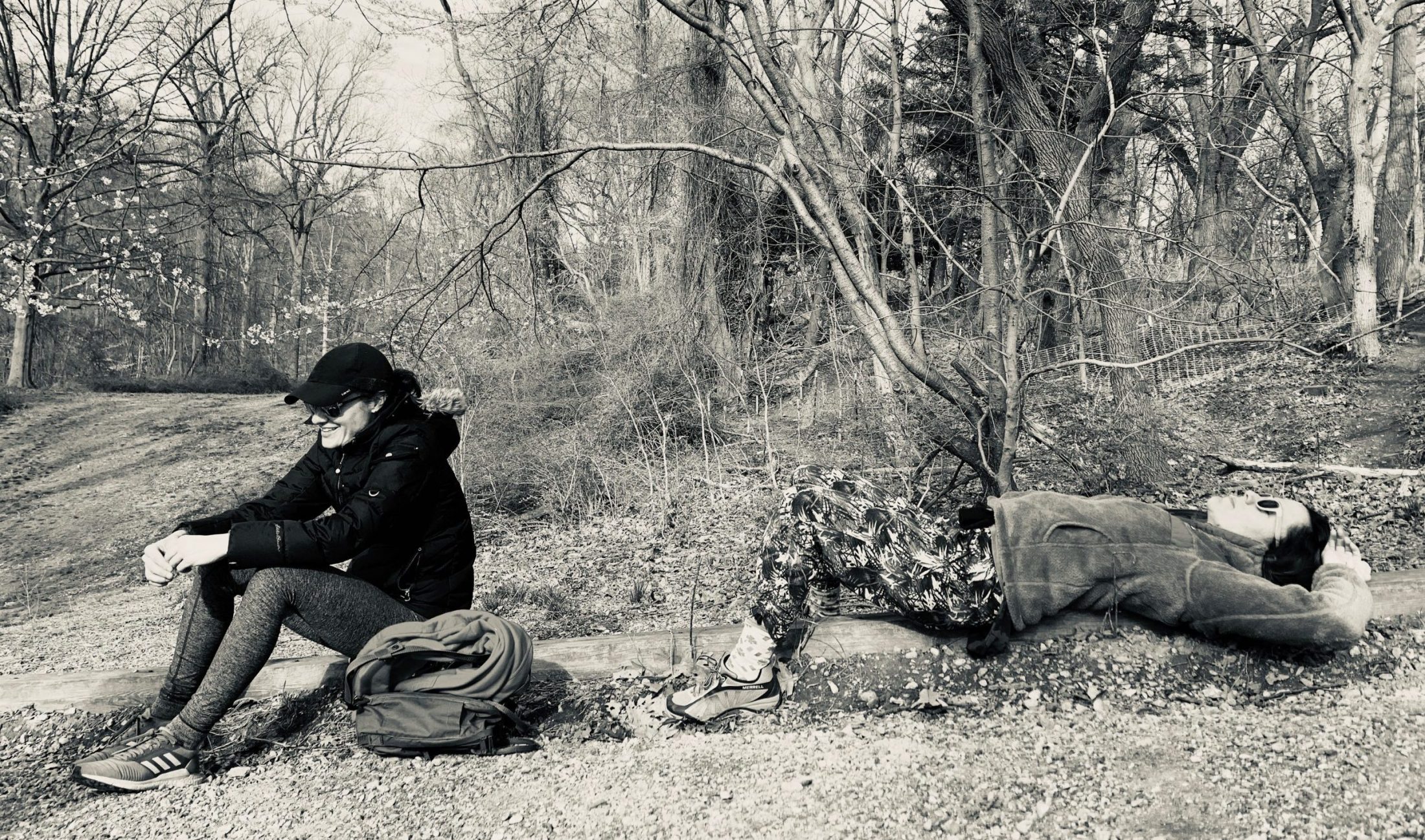 DC widow blog writer Marjorie Brimley in sits in woods with friend
