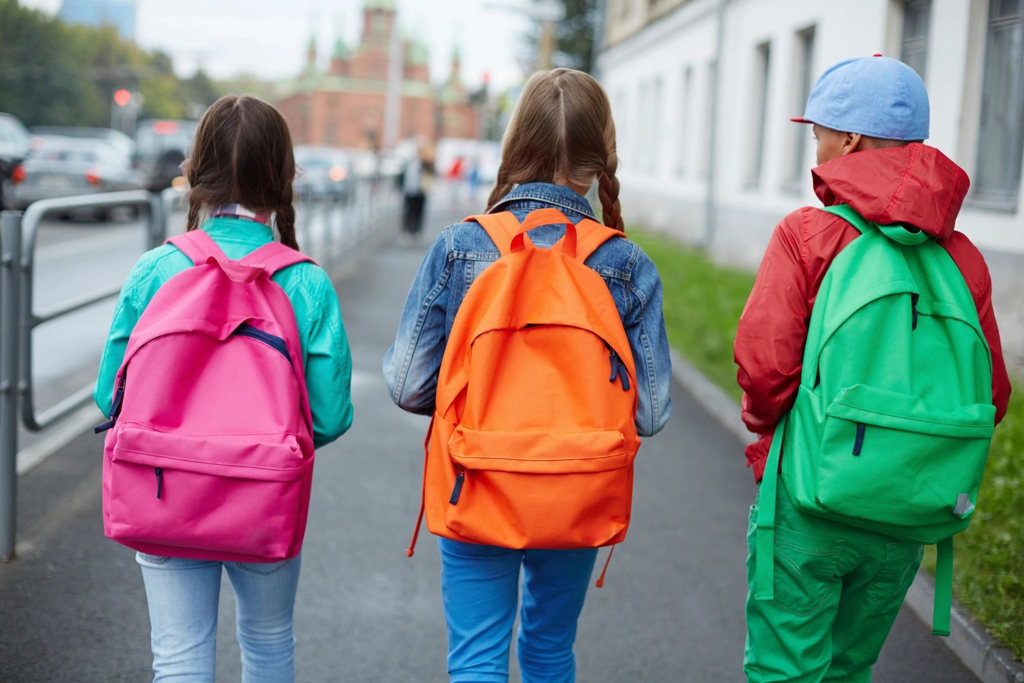 Kids walking into school with backpacks like children of DC widow blog writer Marjorie Brimley