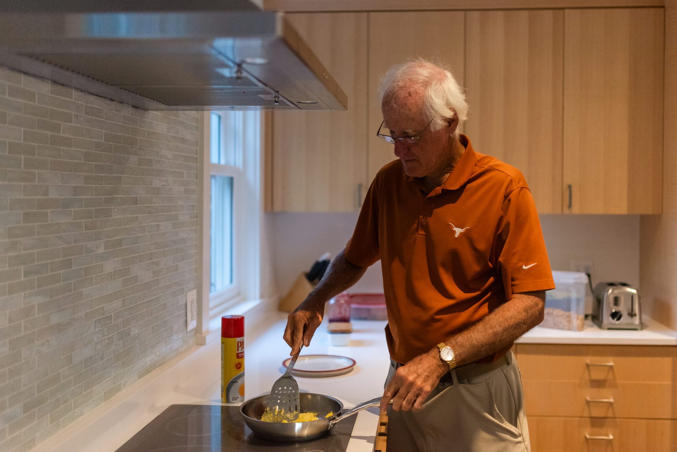 Father of DC widow blog writer Marjorie Brimley cooks egg in kitchen