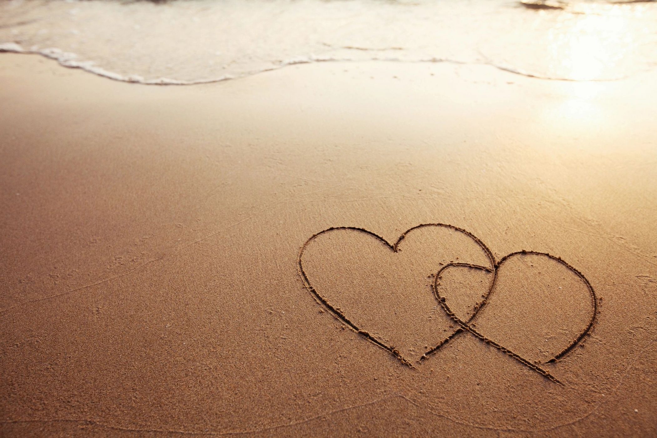 Beach with hearts for blog by DC widow writer Marjorie Brimley