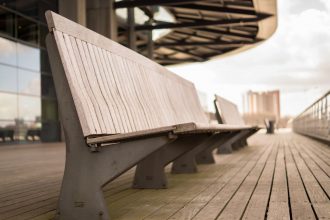 Empty bench on boardwalk for blog by DC widow writer Marjorie Brimley