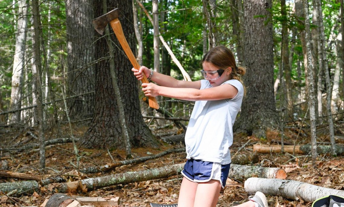 Claire, daughter of DC widow blog writer Marjorie Brimley, chops wood