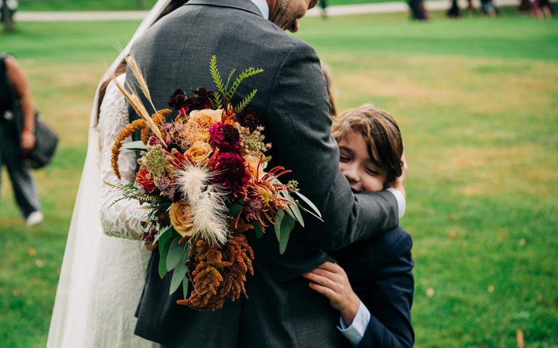 Husband of DC widow blog writer Marjorie Brimley Hale hugs their son at wedding