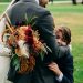 Husband of DC widow blog writer Marjorie Brimley Hale hugs their son at wedding