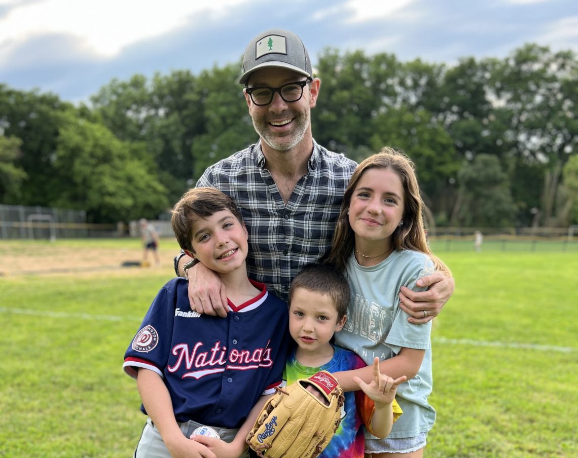 Children and husband of DC widow blog writer Marjorie Brimley Hale pose at baseball game