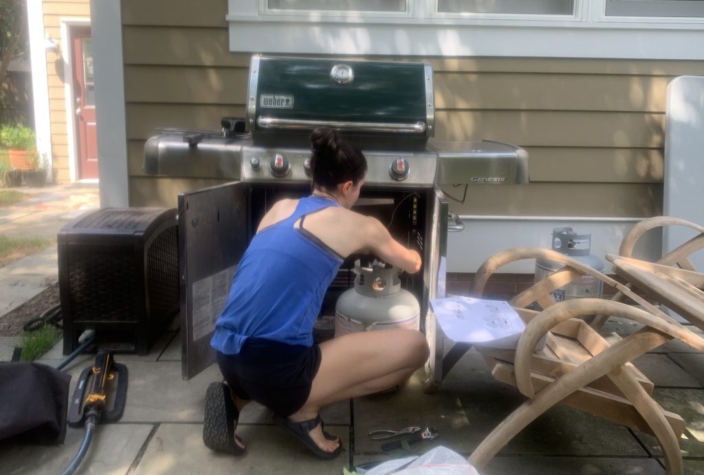 DC widow blog writer Marjorie Brimley using tools to fix grill