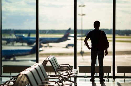 Man waiting at airport by DC widow blog writer Marjorie Brimley Hale